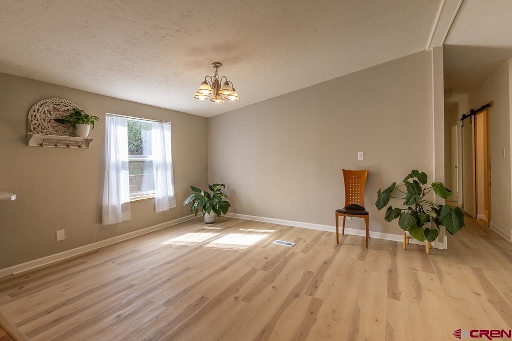 281 Alpine Drive Durango, CO 81301 - Photo 19 of 42 a view of a room with wooden floor and windows