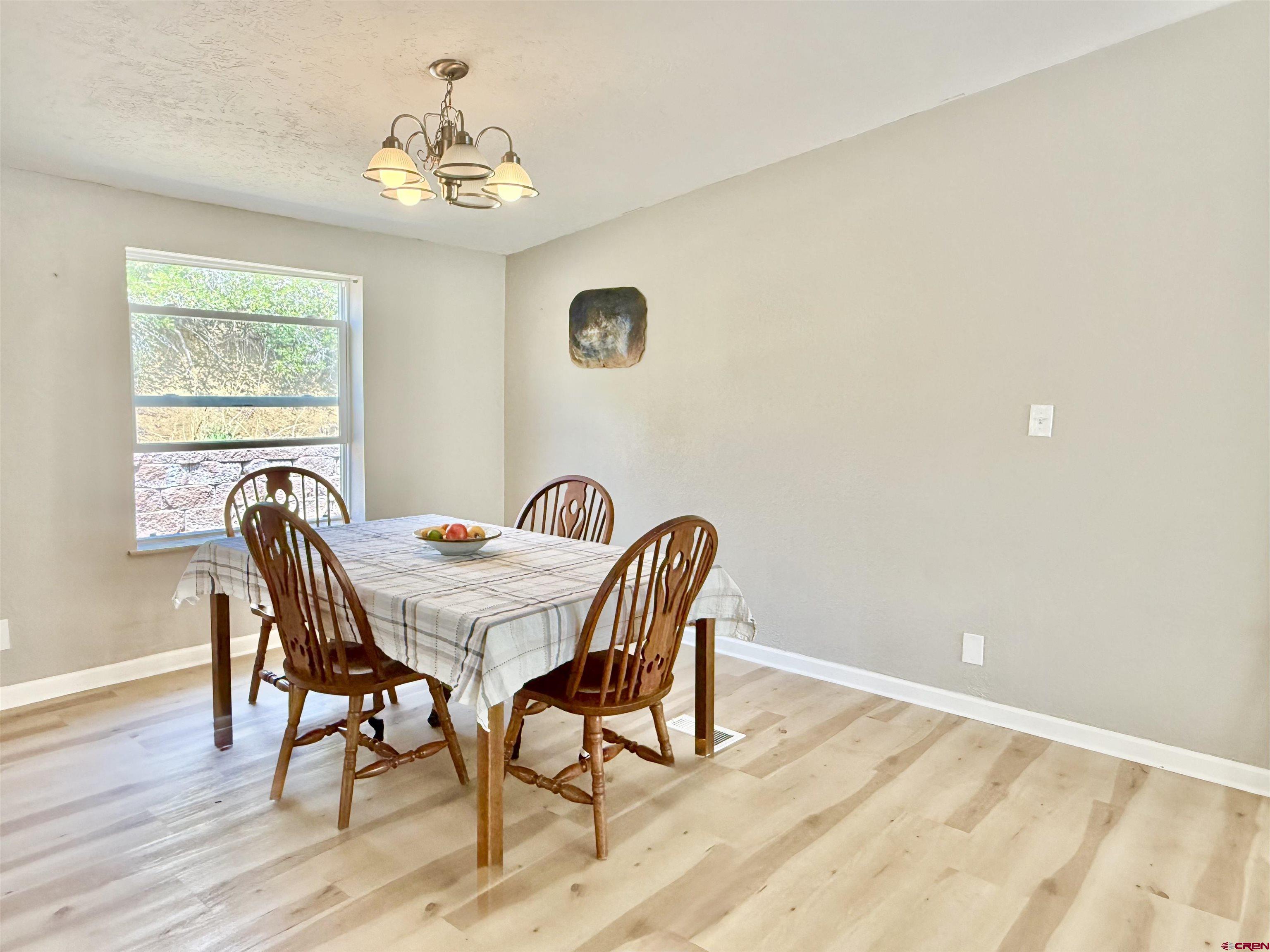 281 Alpine Drive Durango, CO 81301 - Photo 20 of 42 a view of a dining room with furniture and window