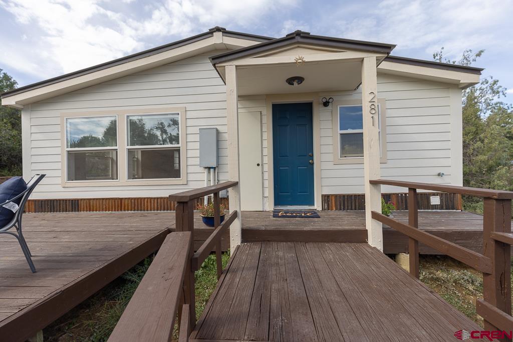 281 Alpine Drive Durango, CO 81301 - Photo 2 of 42 a view of a house with a wooden deck