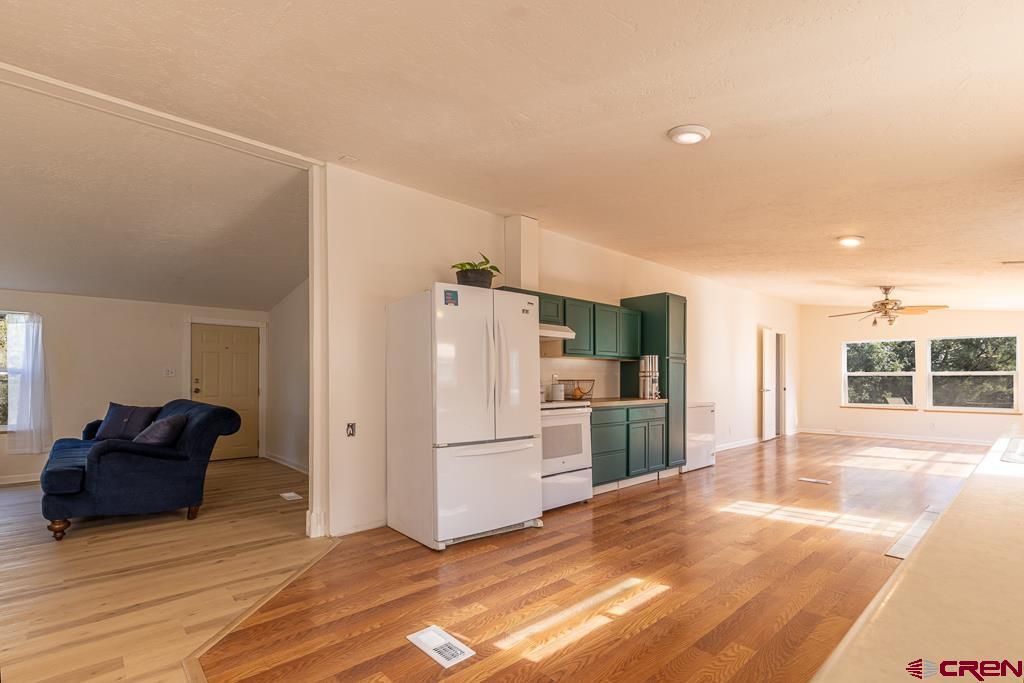 281 Alpine Drive Durango, CO 81301 - Photo 21 of 42 a kitchen with stainless steel appliances a refrigerator and a stove top oven
