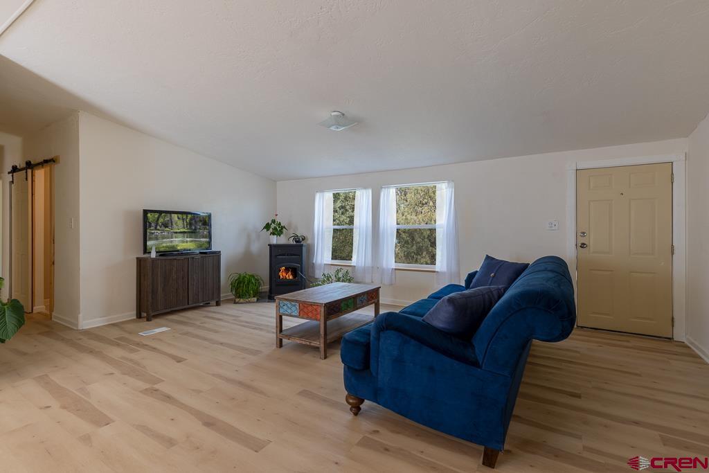 281 Alpine Drive Durango, CO 81301 - Photo 22 of 42 a living room with furniture and a window
