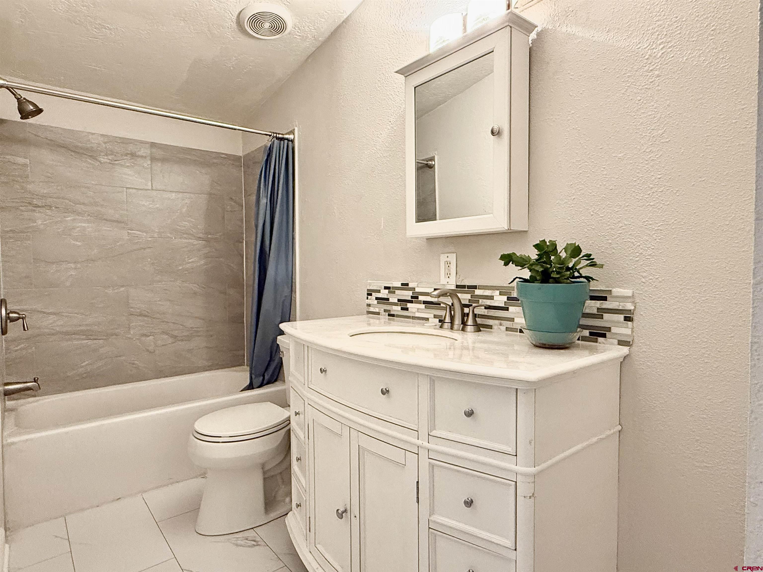 281 Alpine Drive Durango, CO 81301 - Photo 26 of 42 a bathroom with a sink toilet and shower