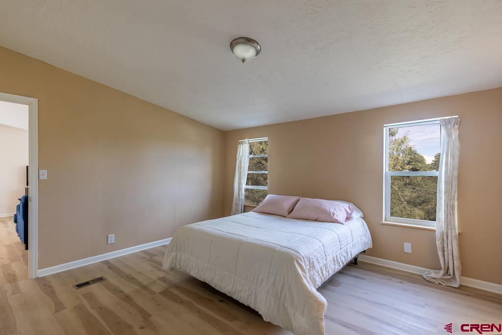 281 Alpine Drive Durango, CO 81301 - Photo 27 of 42 a bedroom with a bed and a window