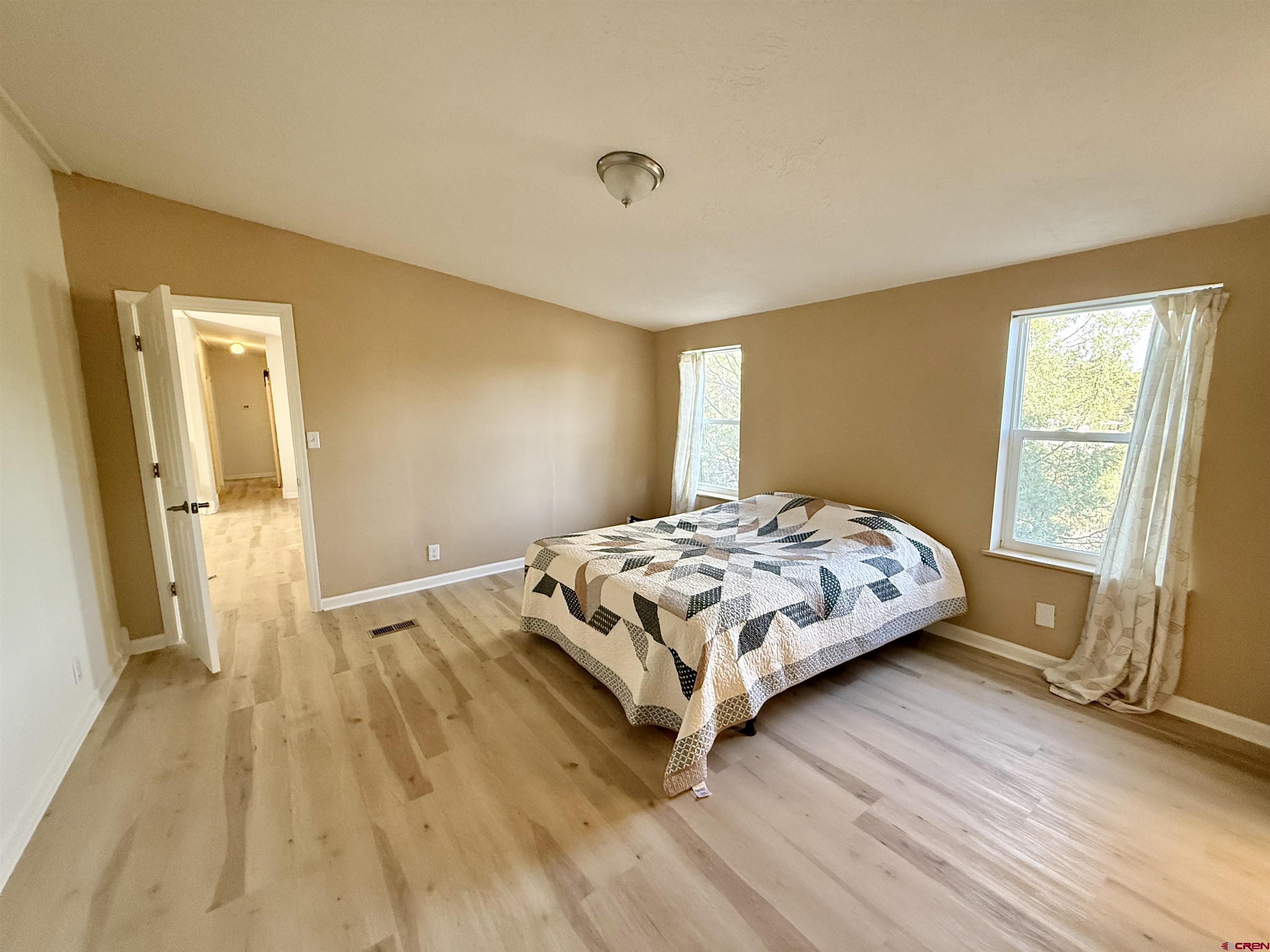 281 Alpine Drive Durango, CO 81301 - Photo 30 of 42 a bedroom with a bed and a window