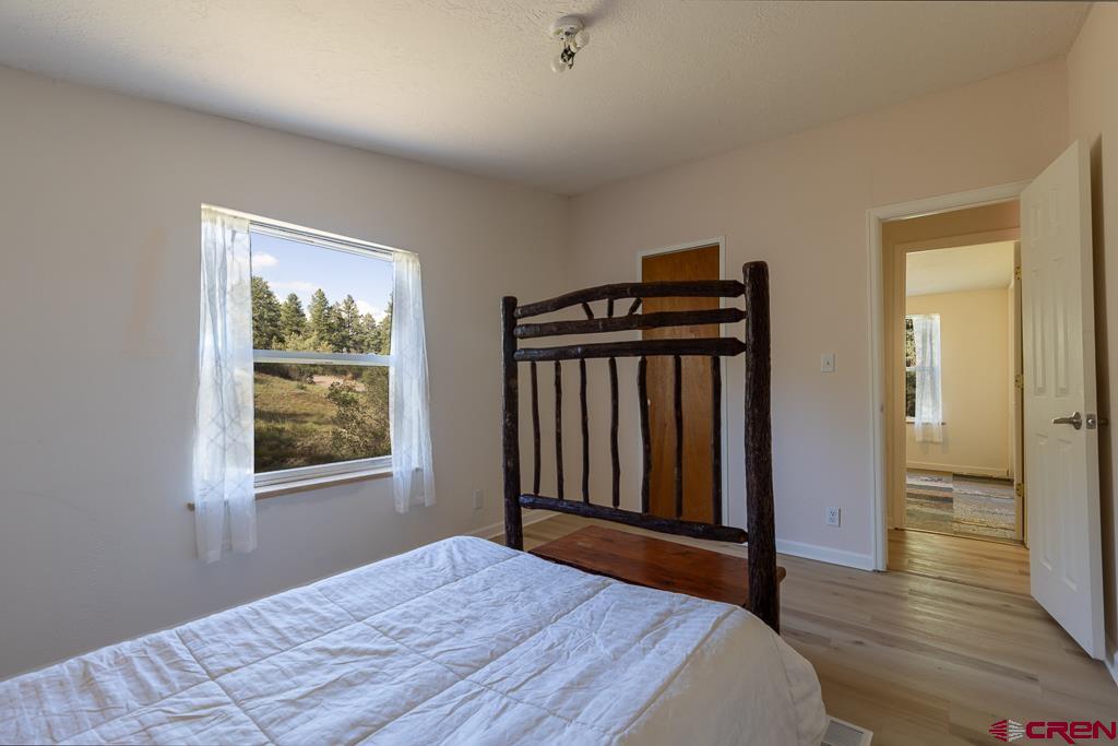 281 Alpine Drive Durango, CO 81301 - Photo 34 of 42 a bedroom with a bed and a window