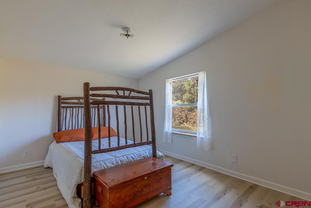 281 Alpine Drive Durango, CO 81301 - Photo 35 of 42 a bedroom with furniture and window