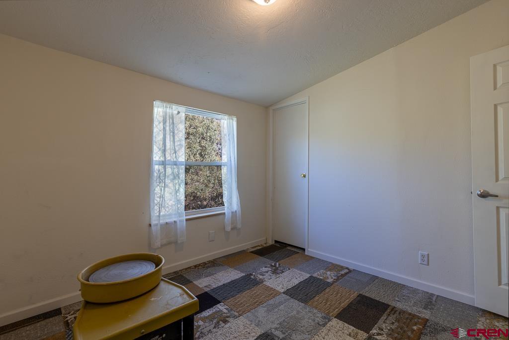 281 Alpine Drive Durango, CO 81301 - Photo 37 of 42 a view of a room with windows and lounge chair