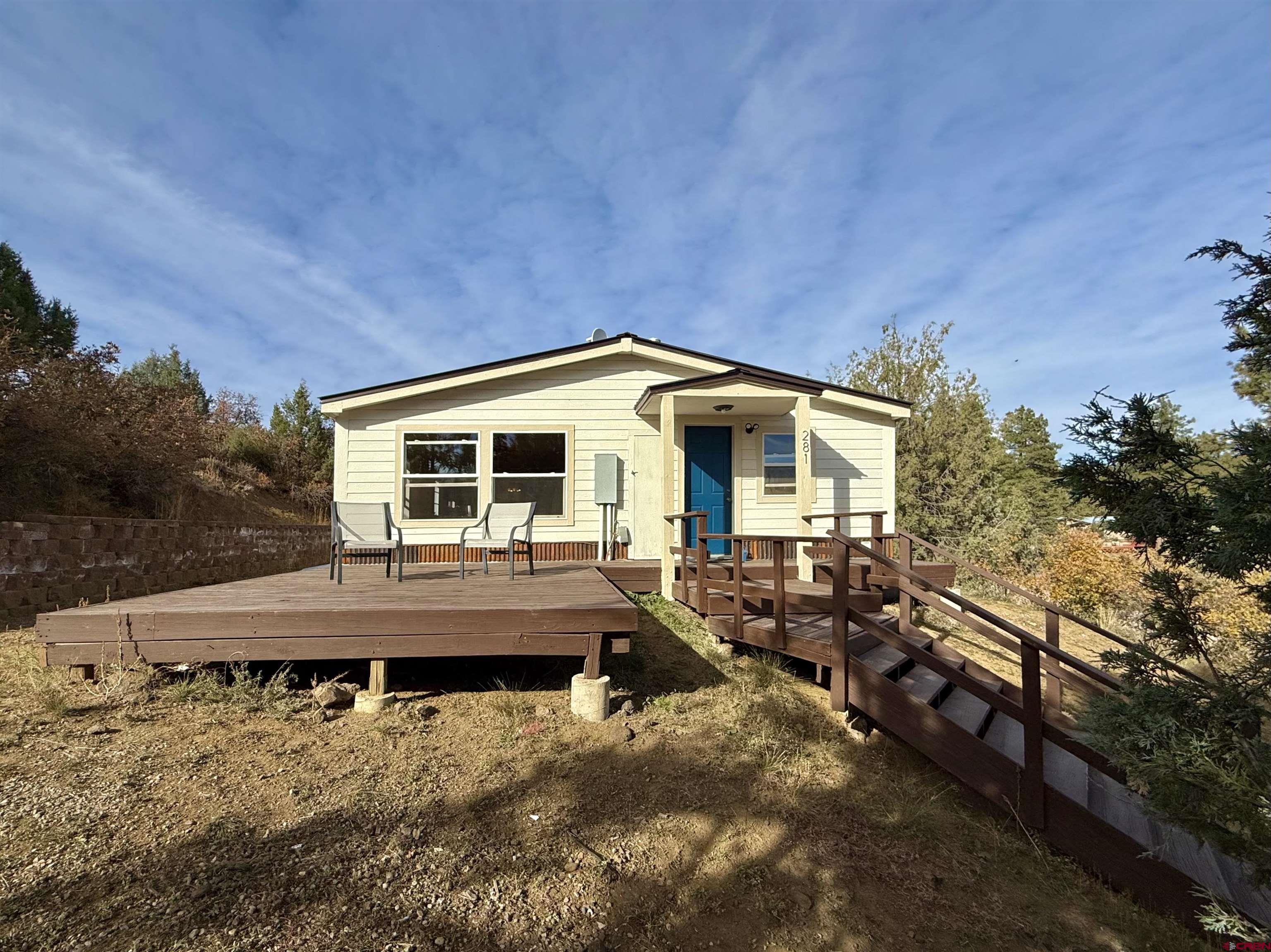 281 Alpine Drive Durango, CO 81301 - Photo 39 of 42 a view of house with backyard and sitting area