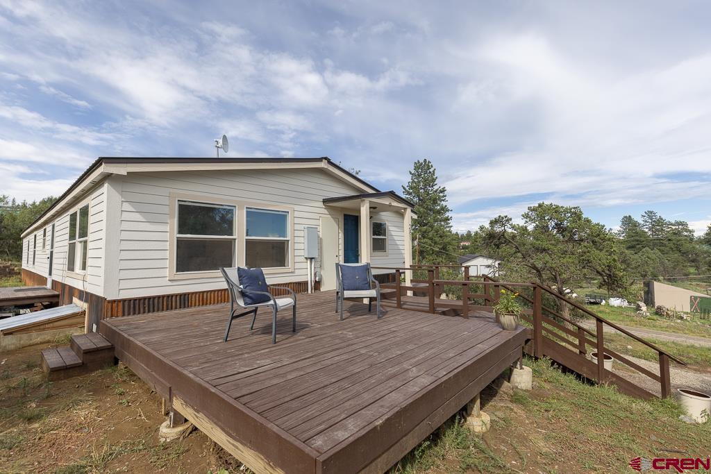 281 Alpine Drive Durango, CO 81301 - Photo 4 of 42 a terrace with outdoor seating and trees