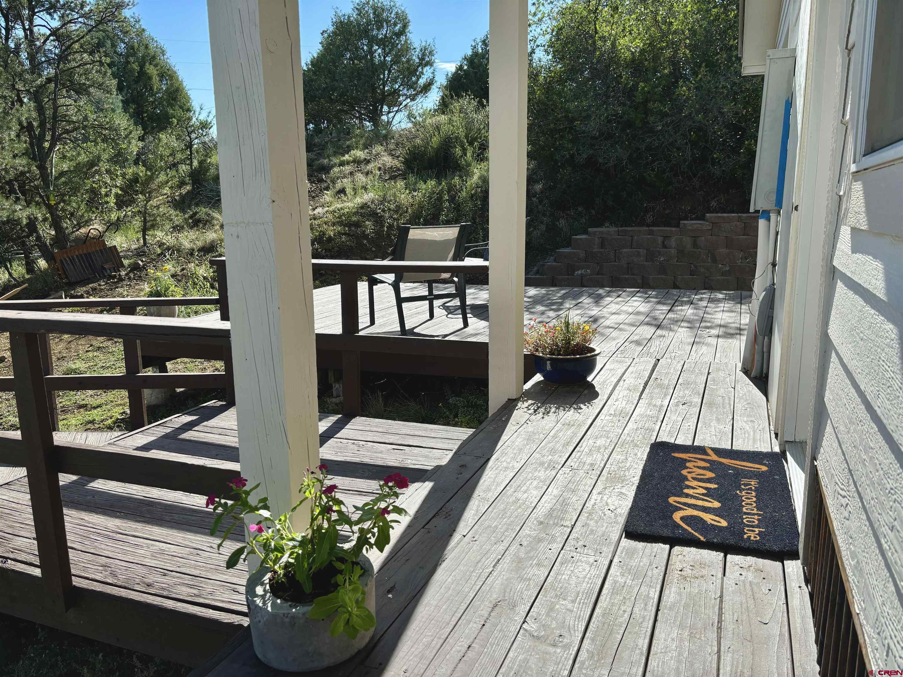 281 Alpine Drive Durango, CO 81301 - Photo 6 of 42 a view of balcony with chairs and wooden floor
