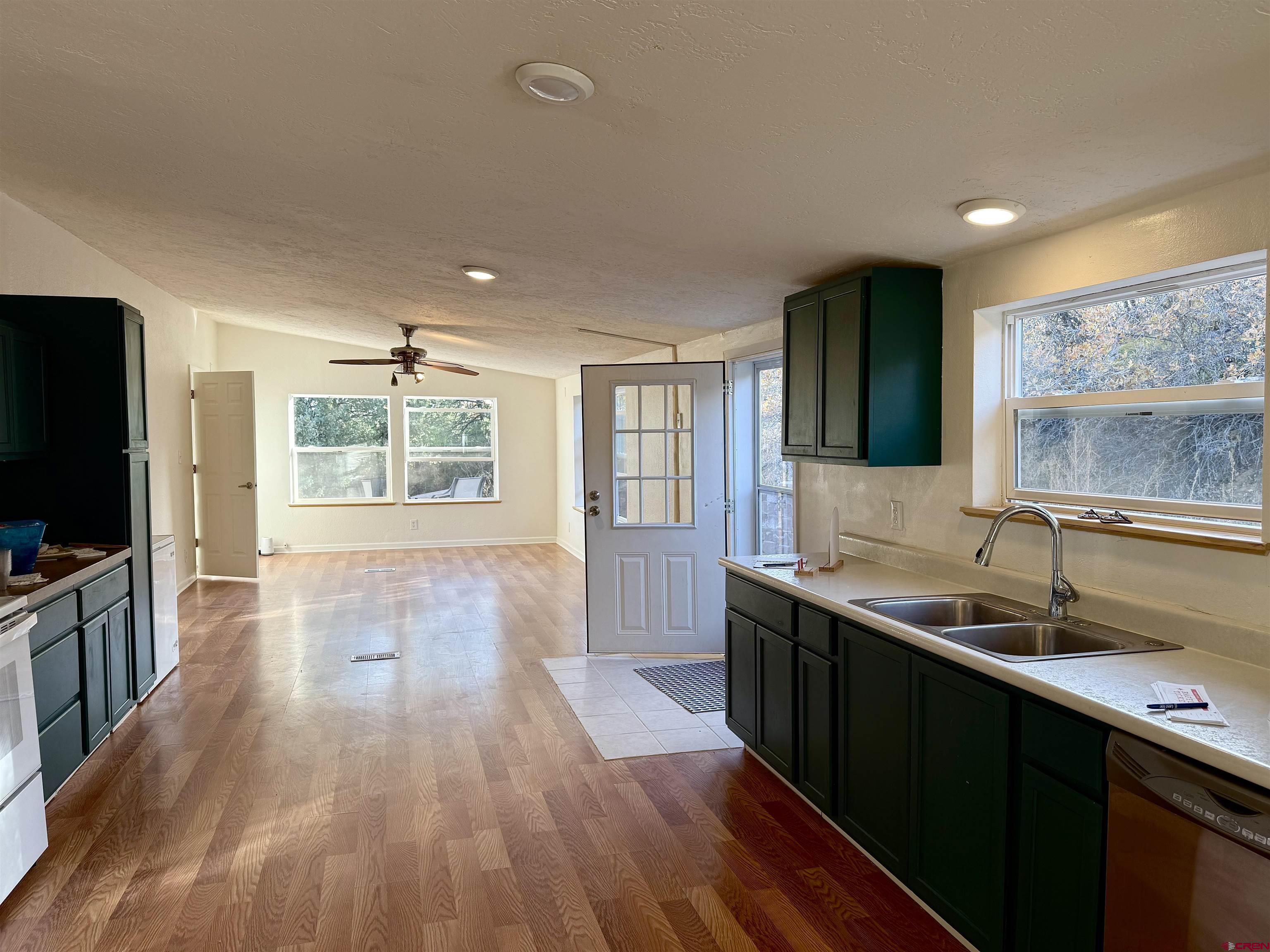 281 Alpine Drive Durango, CO 81301 - Photo 9 of 42 a kitchen with a sink and wooden floor
