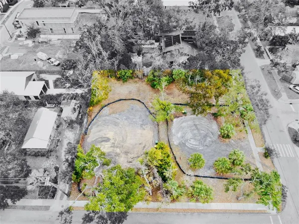 an aerial view of a swimming pool with outdoor space