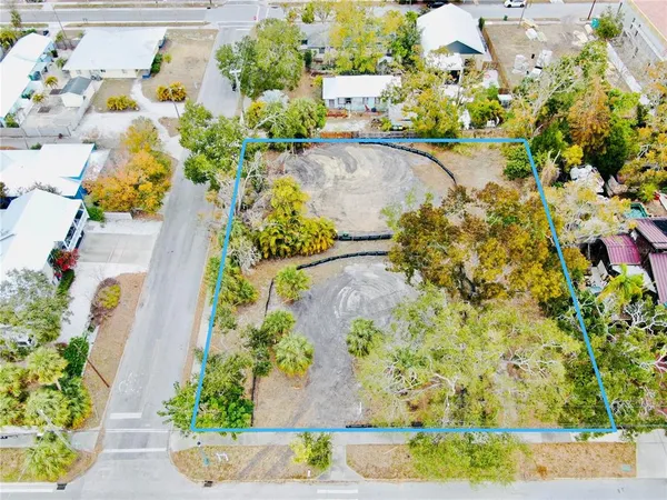 an aerial view of a house with a yard and swimming pool