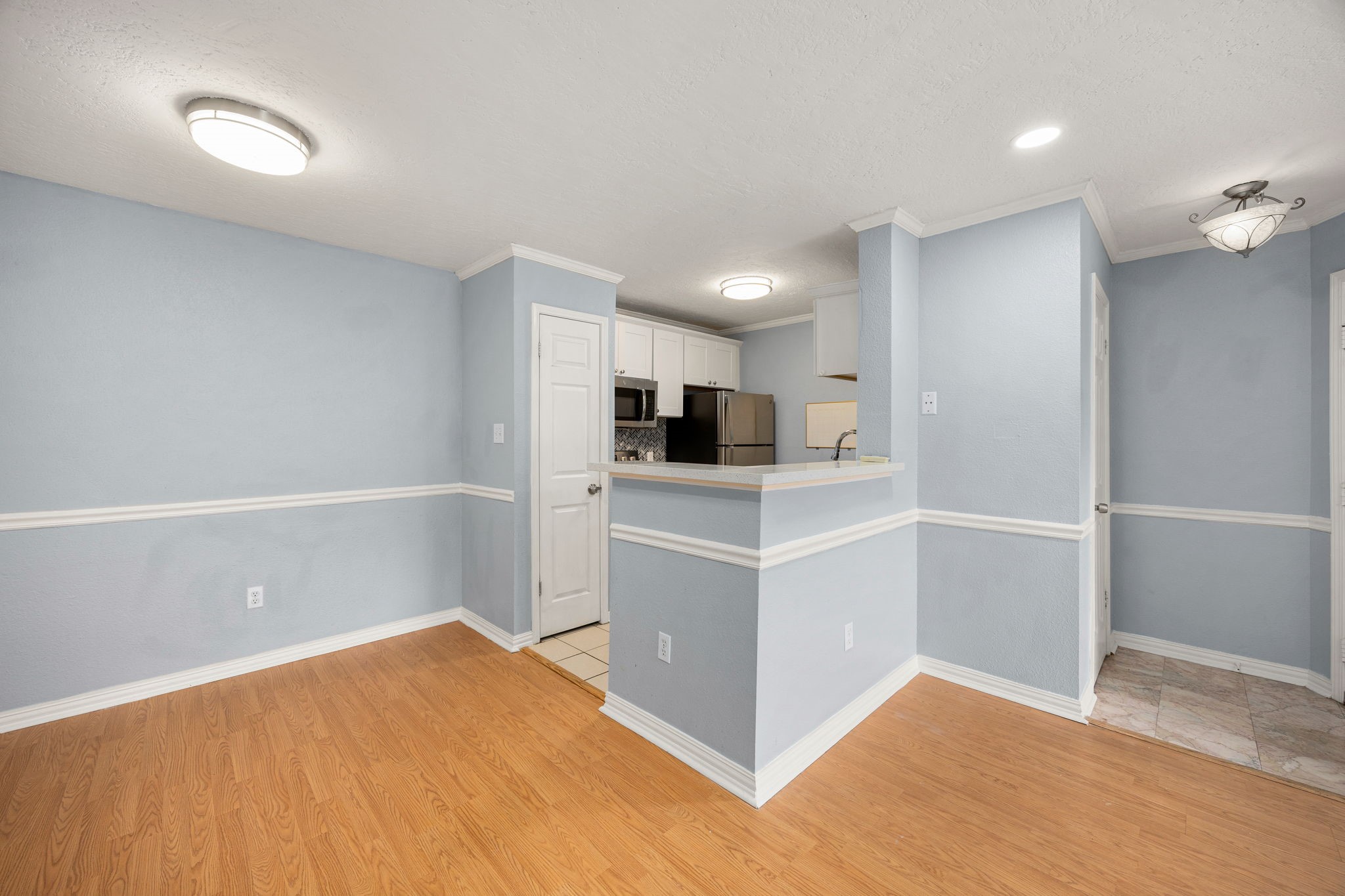 2121 Hepburn Street, Unit 710 Houston, TX 77054 - Photo 12 of 35 a kitchen with white cabinets and white appliances
