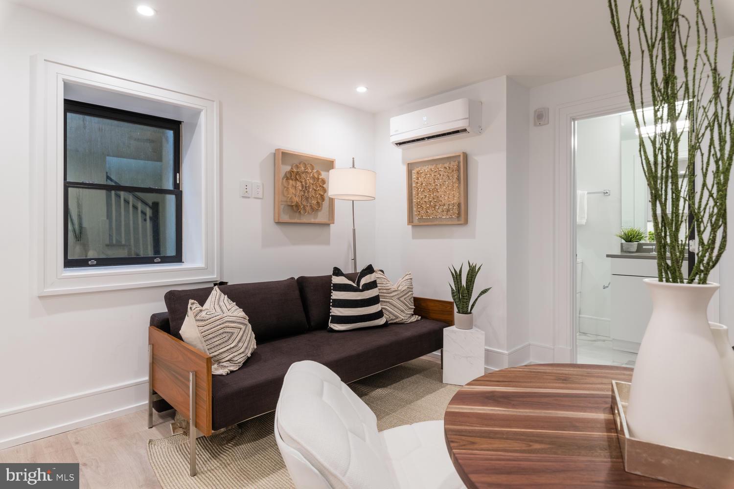 1524 18th Street Northwest, Unit 1 Washington, DC 20036 - Photo 15 of 20 a living room with furniture and a window