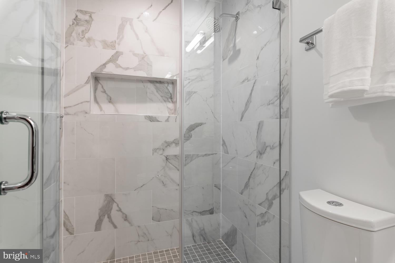 1524 18th Street Northwest, Unit 1 Washington, DC 20036 - Photo 17 of 20 a bathroom with a shower and toilet