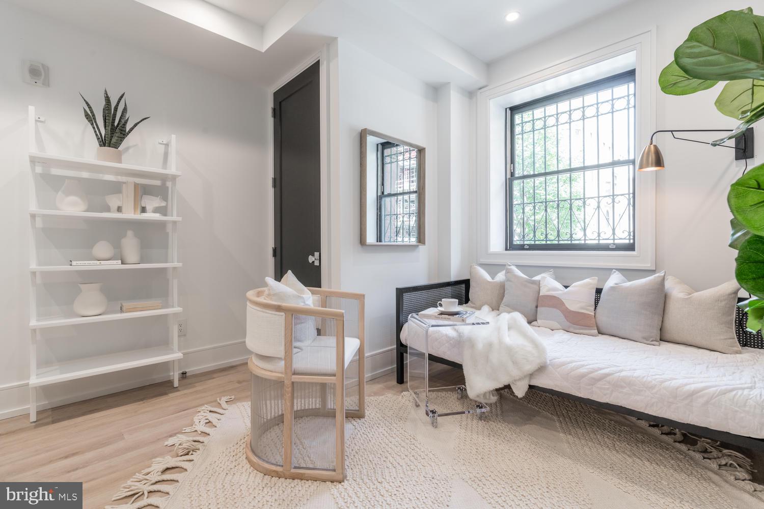 1524 18th Street Northwest, Unit 1 Washington, DC 20036 - Photo 5 of 20 a living room with furniture and a window