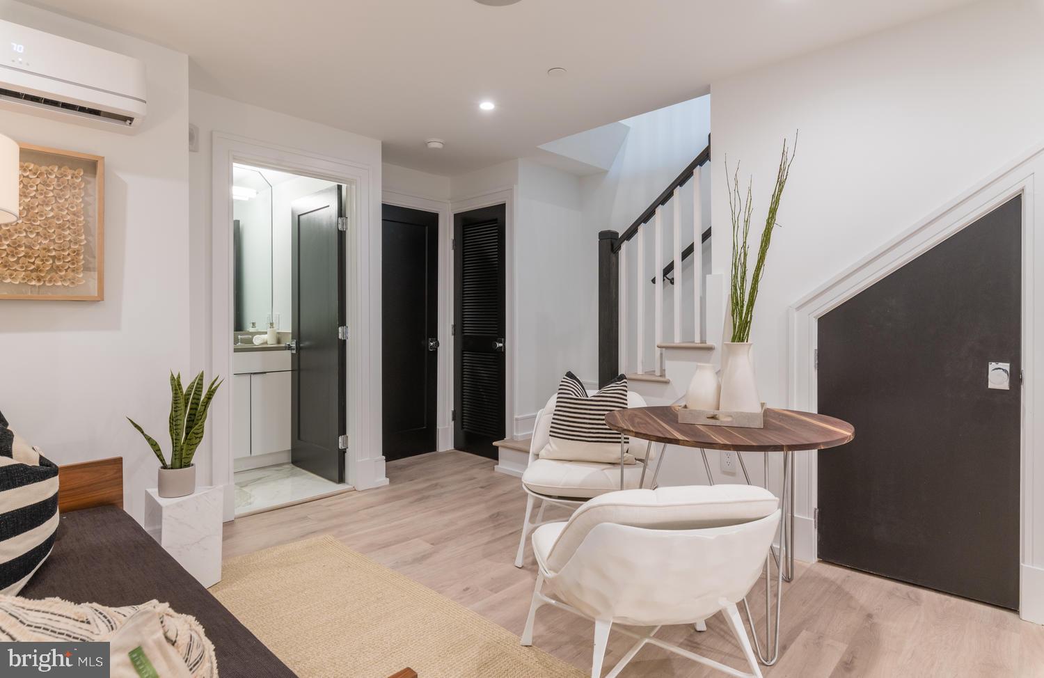 1524 18th Street Northwest, Unit 1 Washington, DC 20036 - Photo 6 of 20 a living room with furniture and wooden floor