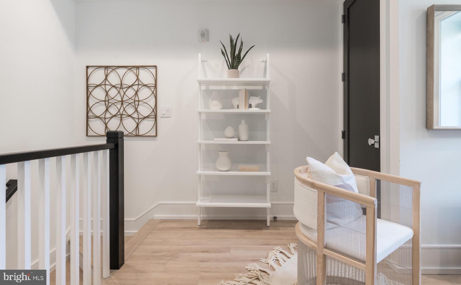 1524 18th Street Northwest, Unit 1 Washington, DC 20036 - Photo 9 of 20 a view of a hallway with wooden floor and a dining room