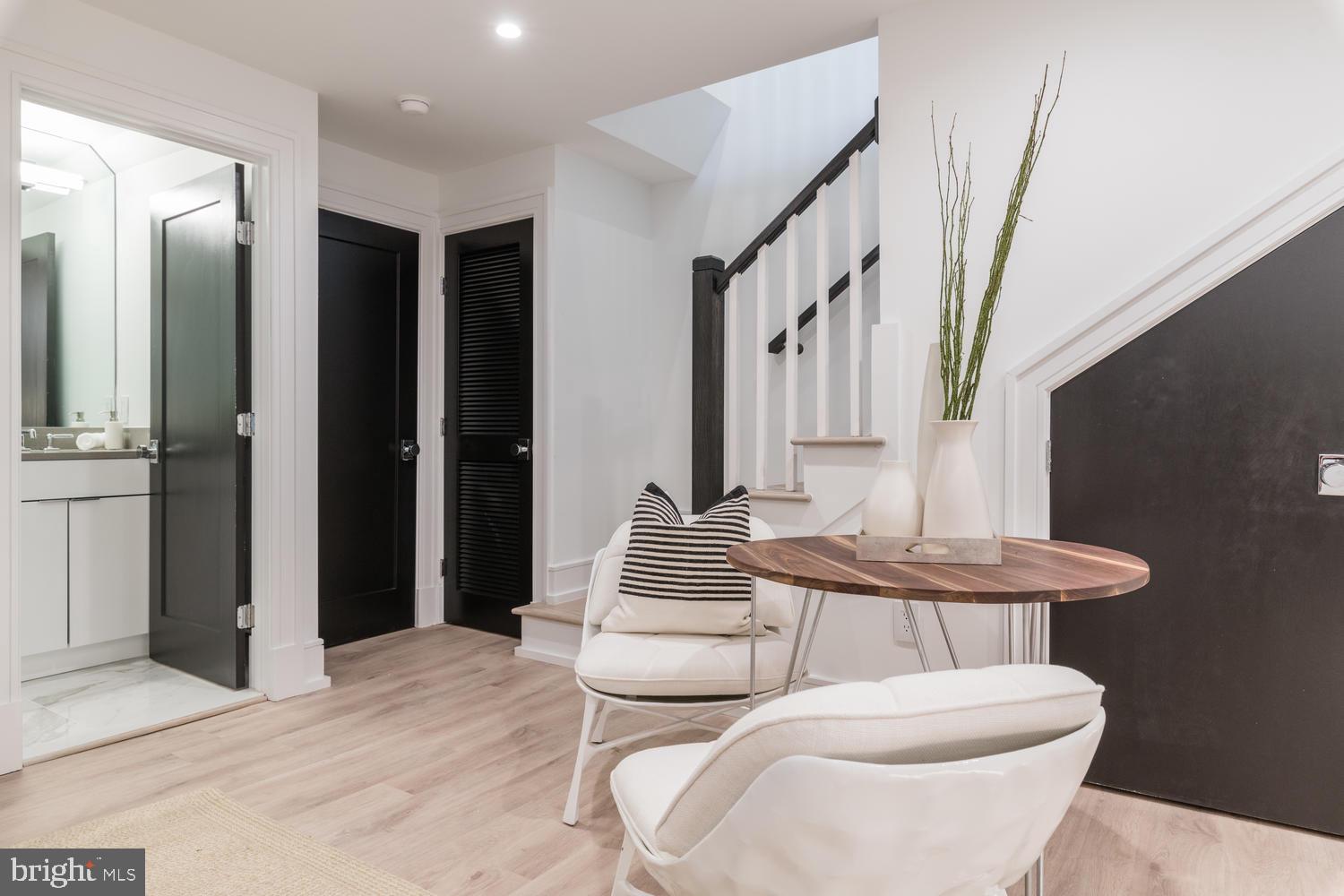 1524 18th Street Northwest, Unit 1 Washington, DC 20036 - Photo 10 of 20 a bathroom with a toilet sink and mirror