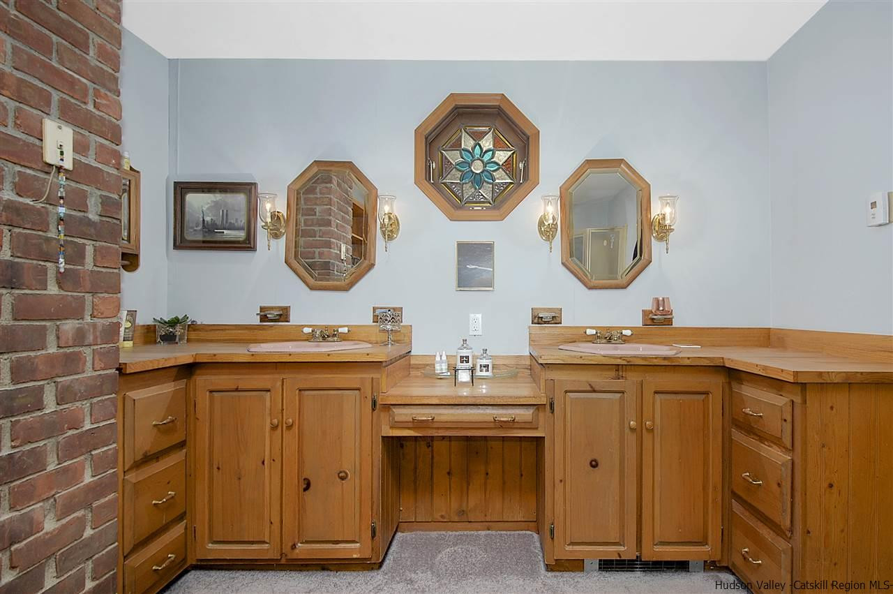 8 Jansen Road Stone Ridge, NY 12484 - Photo 20 of 28 a view of a kitchen with a sink and a clock