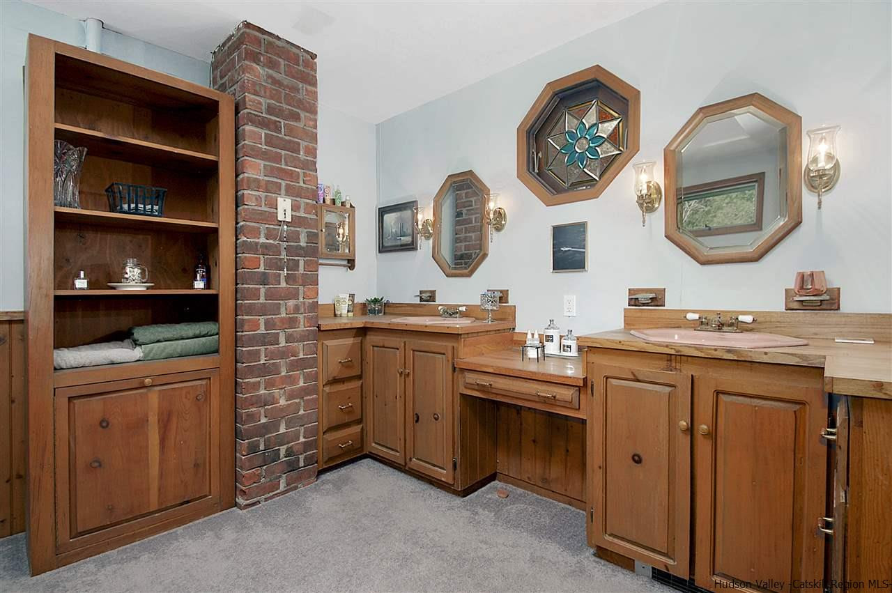 8 Jansen Road Stone Ridge, NY 12484 - Photo 21 of 28 a bathroom with a double vanity sink and a mirror