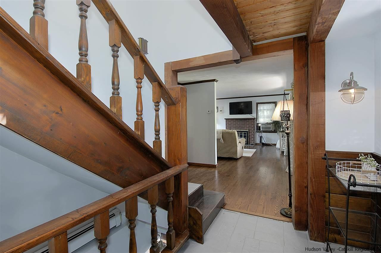 8 Jansen Road Stone Ridge, NY 12484 - Photo 24 of 28 a view of a livingroom with wooden floor and stairs