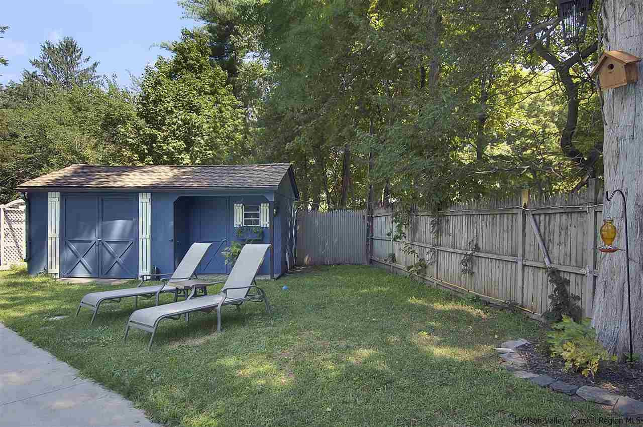 8 Jansen Road Stone Ridge, NY 12484 - Photo 27 of 28 a view of a backyard with table and chairs and wooden fence