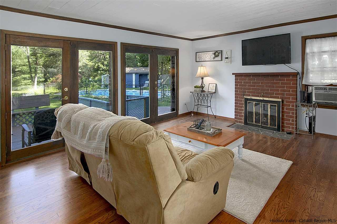 8 Jansen Road Stone Ridge, NY 12484 - Photo 4 of 28 a living room with furniture and a fireplace