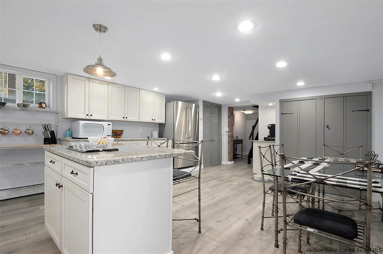 8 Jansen Road Stone Ridge, NY 12484 - Photo 10 of 28 a kitchen with a stove a sink and a refrigerator