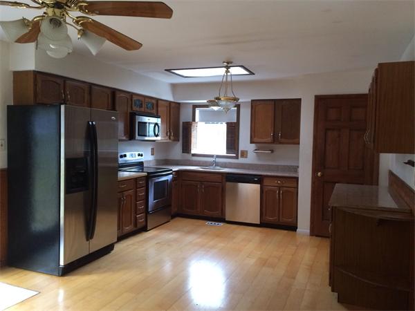 220 Sheldon Road Barre, MA 01005 - Photo 3 of 7 a large kitchen with cabinets and stainless steel appliances