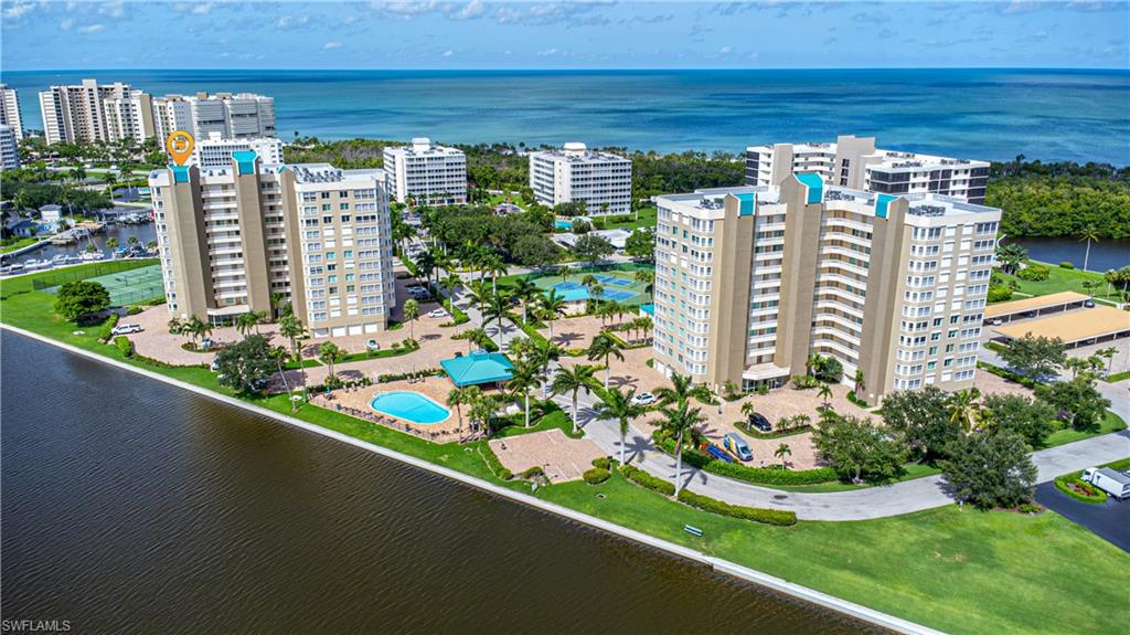 21 Bluebill Avenue, Unit 902 Naples, FL 34108 - Photo 2 of 44 Birds eye view of property featuring a water view