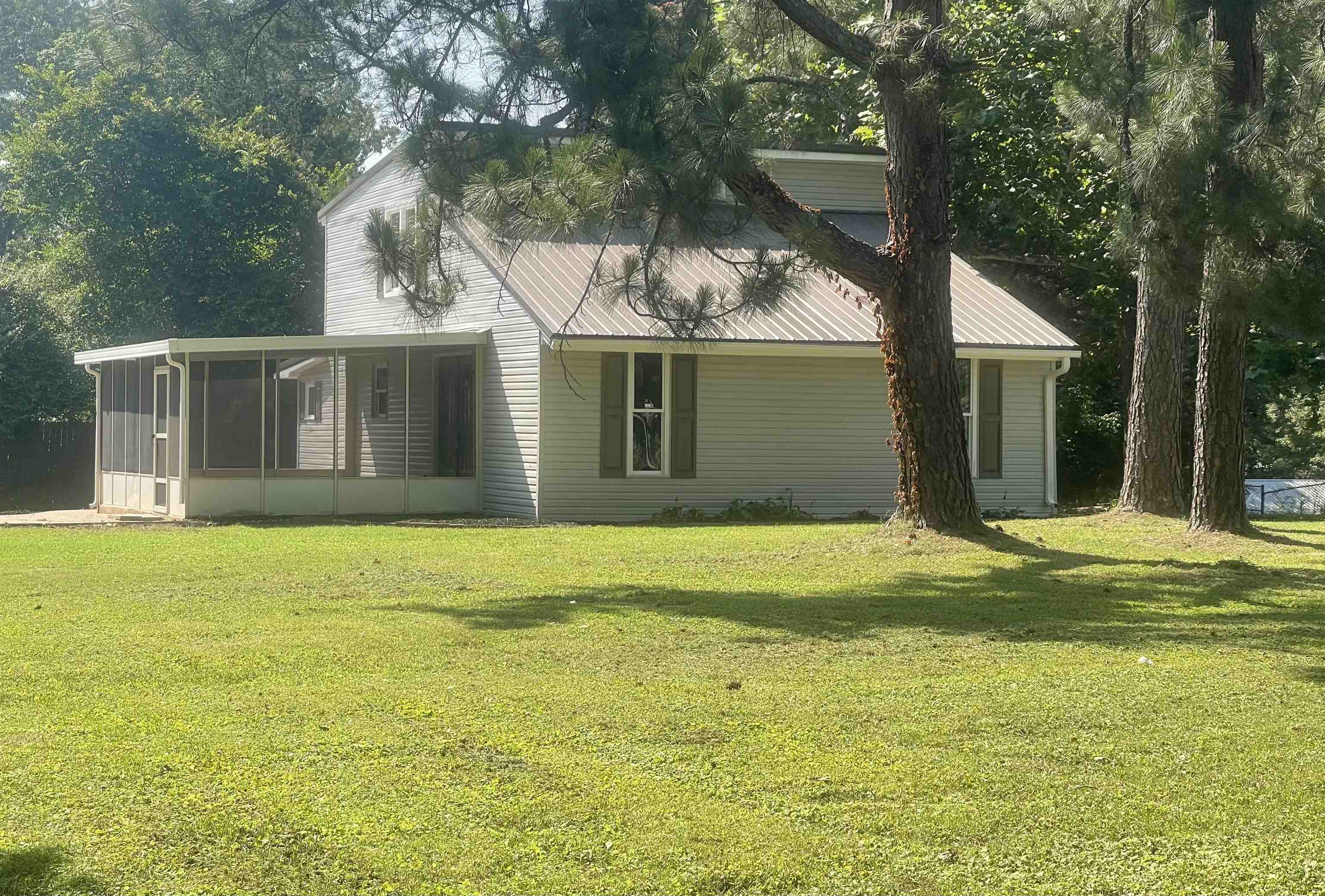 815 Fawn Road Oakland, TN 38060 - Photo 1 of 29 View of front of home with a sunroom, a front yard, and metal roof