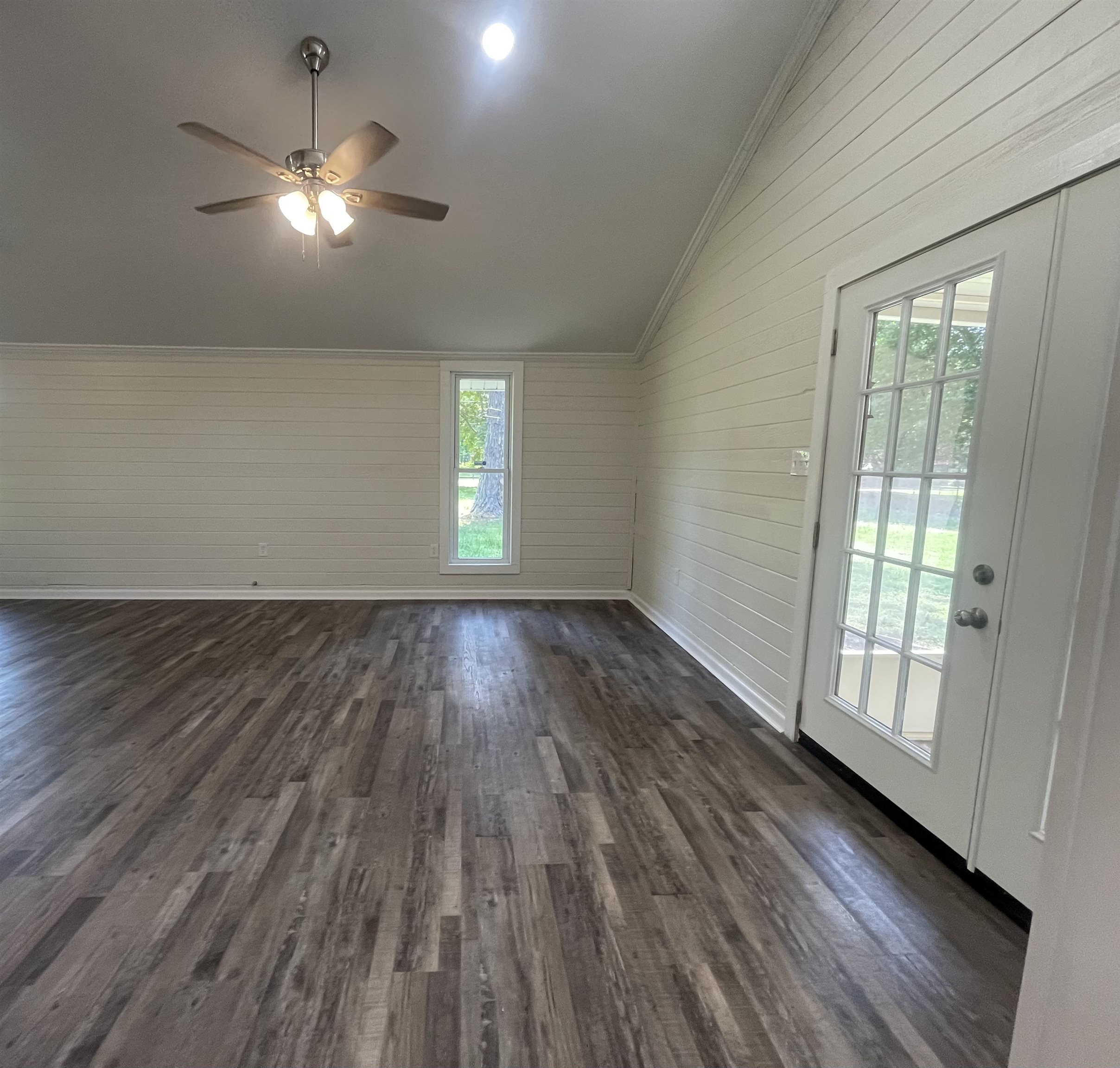 815 Fawn Road Oakland, TN 38060 - Photo 14 of 29 Dining Room featuring lofted ceiling, dark wood-style floors, ornamental molding, baseboards, and ceiling fan