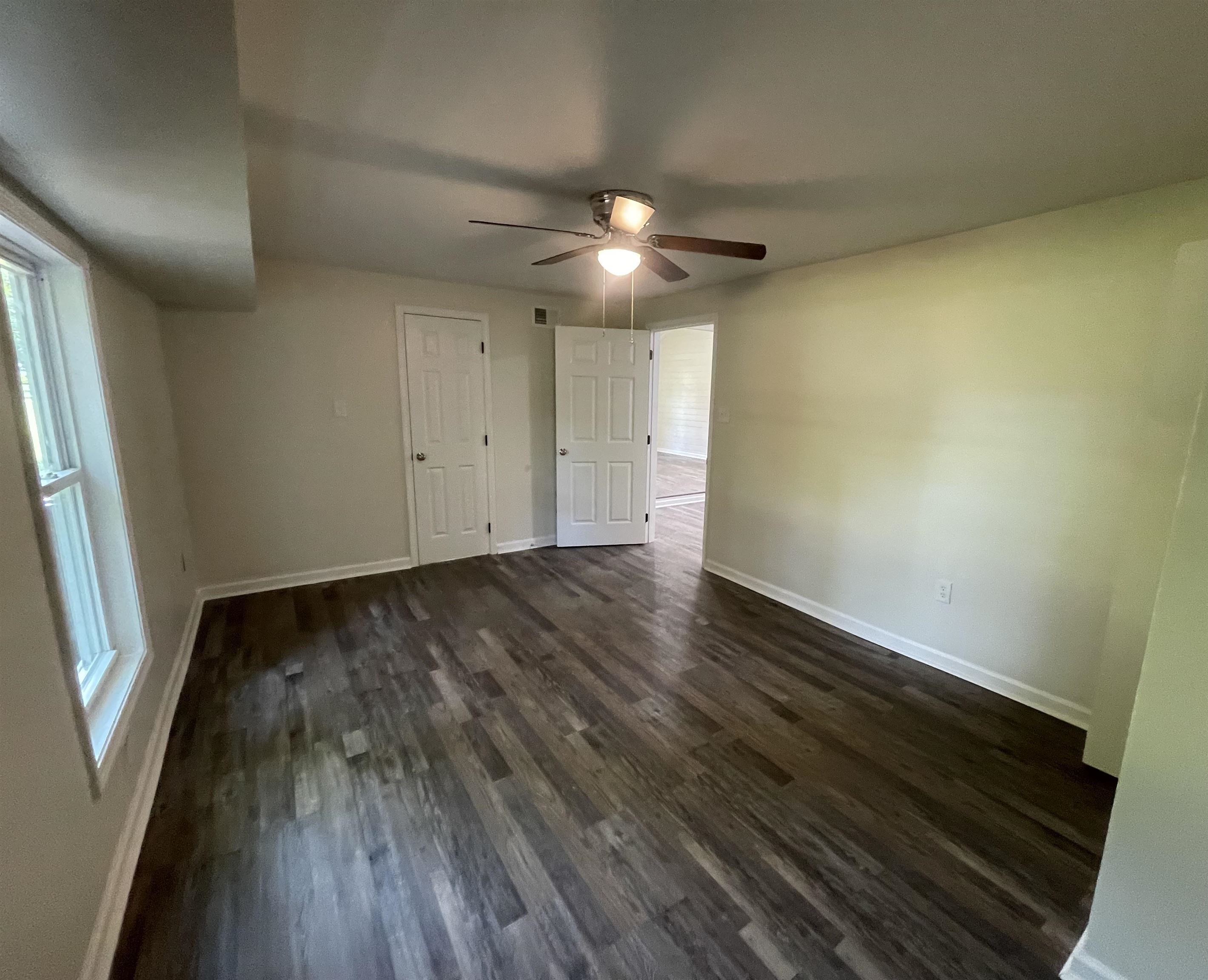 815 Fawn Road Oakland, TN 38060 - Photo 16 of 29 Master Bedroom with baseboards, dark wood-style flooring, and a ceiling fan