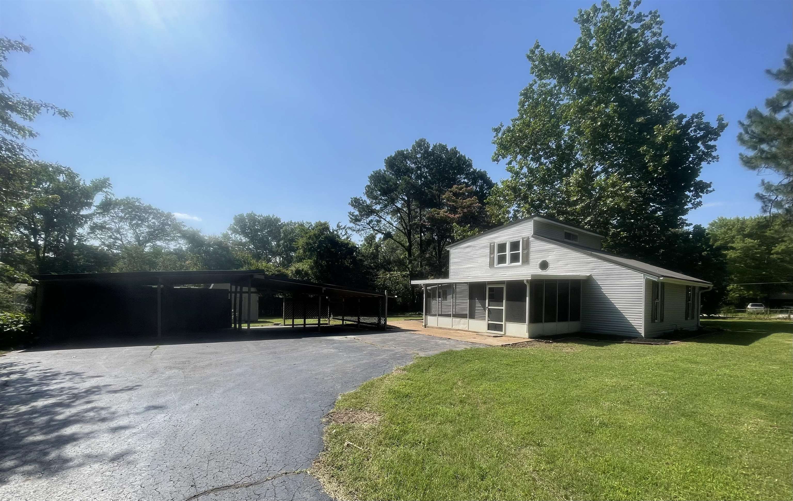 815 Fawn Road Oakland, TN 38060 - Photo 2 of 29 View of front of home with a front yard and a sunroom