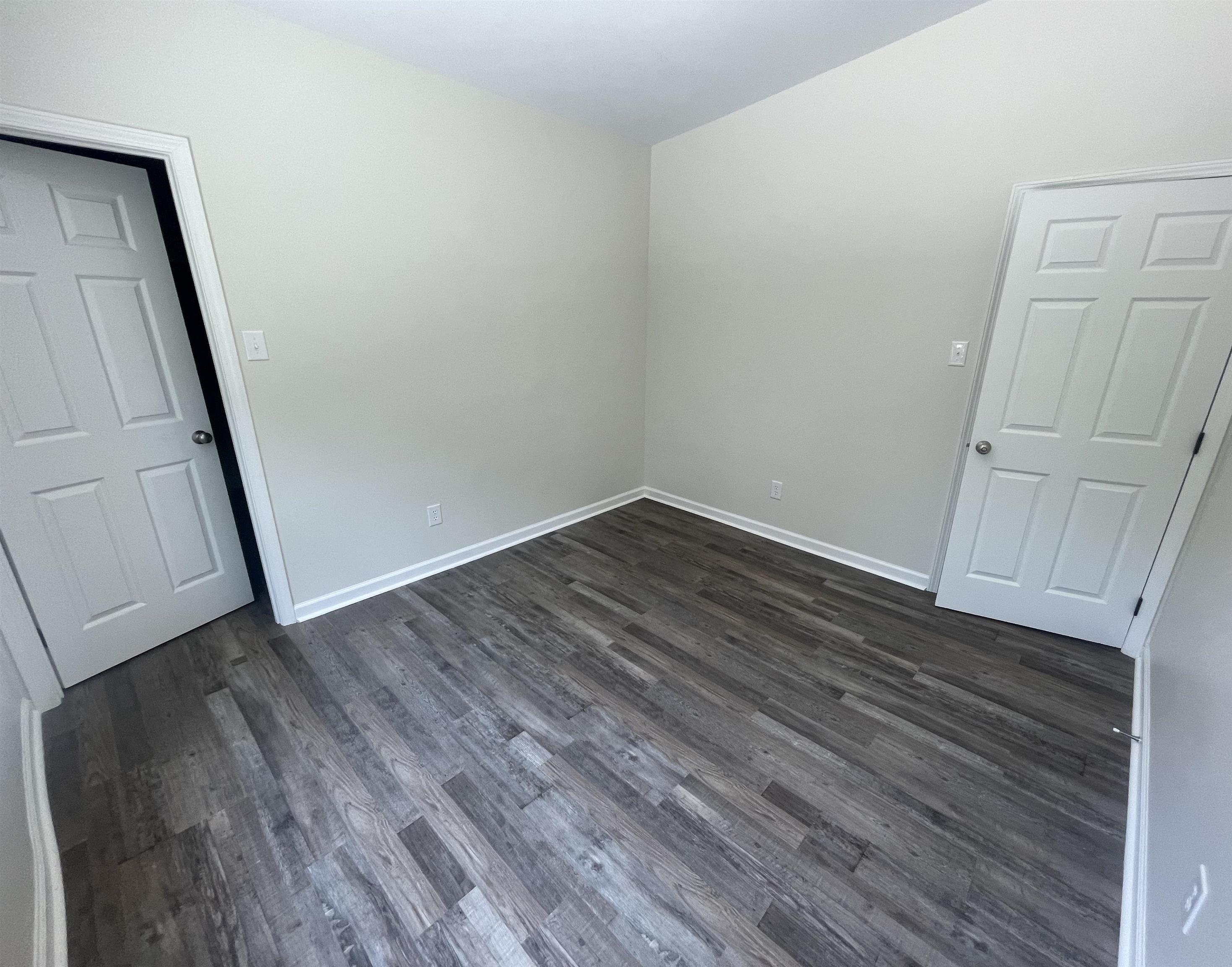 815 Fawn Road Oakland, TN 38060 - Photo 21 of 29 Spare room featuring dark wood finished floors and baseboards