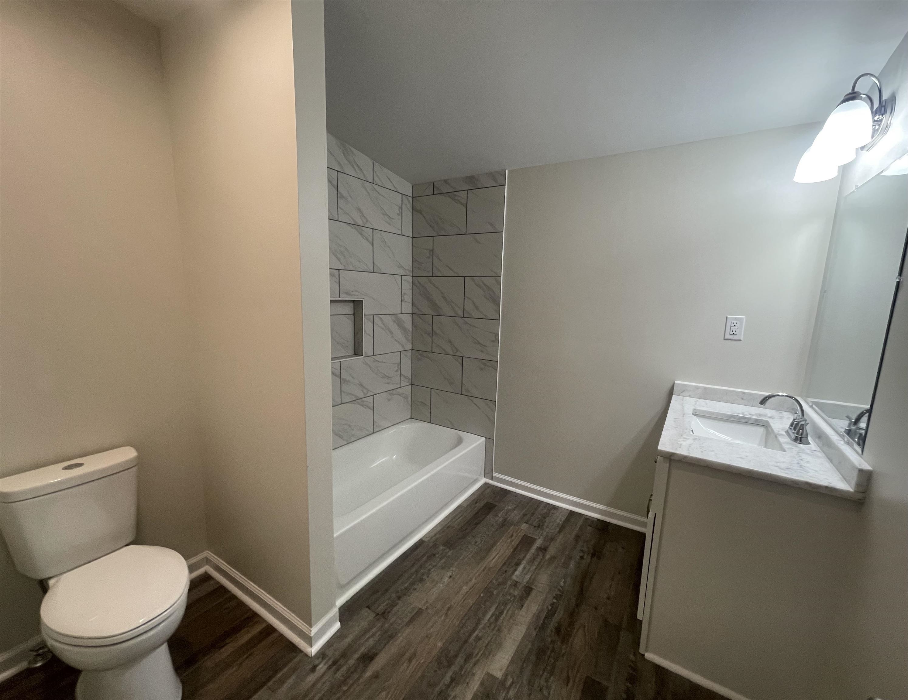 815 Fawn Road Oakland, TN 38060 - Photo 25 of 29 Bathroom featuring vanity, toilet, wood finished floors, and baseboards