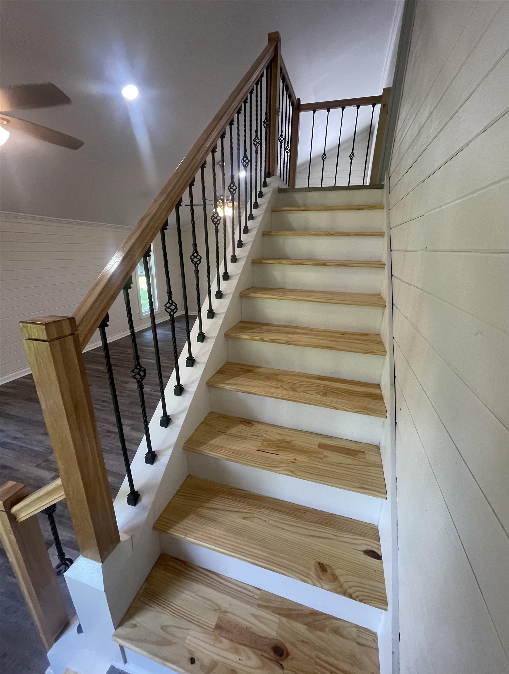 815 Fawn Road Oakland, TN 38060 - Photo 9 of 29 Staircase with ceiling fan, wooden walls, and recessed lighting
