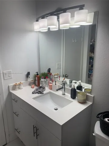 a bathroom with a sink double vanity and a mirror