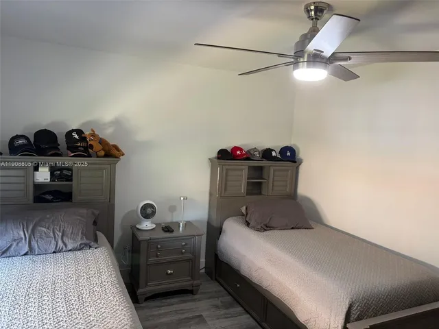 a bedroom with a bed and cabinets