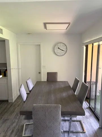 a view of a livingroom with furniture and wooden floor