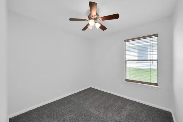 a view of a deck with a big yard