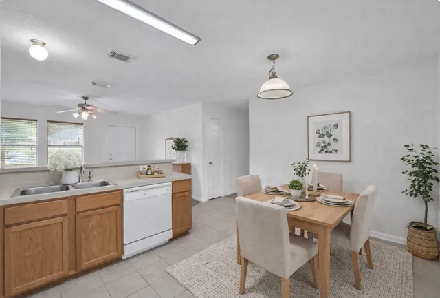 a view of a kitchen with a sink dishwasher and a microwave