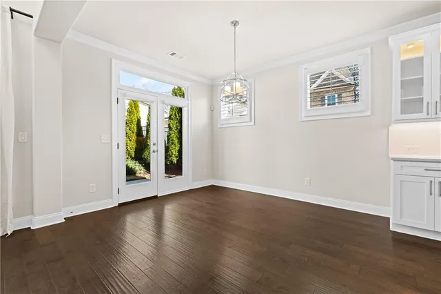 a view of a livingroom with a fireplace wooden floor and staircase