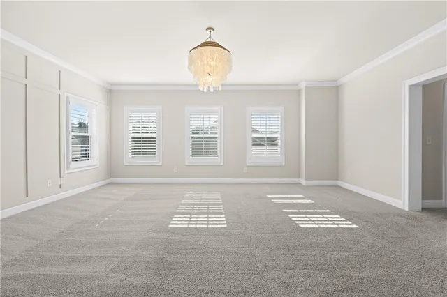 a bathroom with a tub a sink and mirror