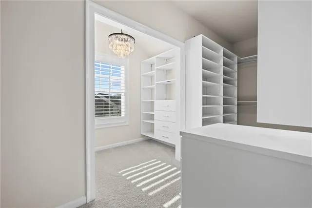 a view of an empty room and a window