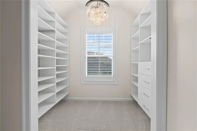 a view of staircase with wooden floor and white walls