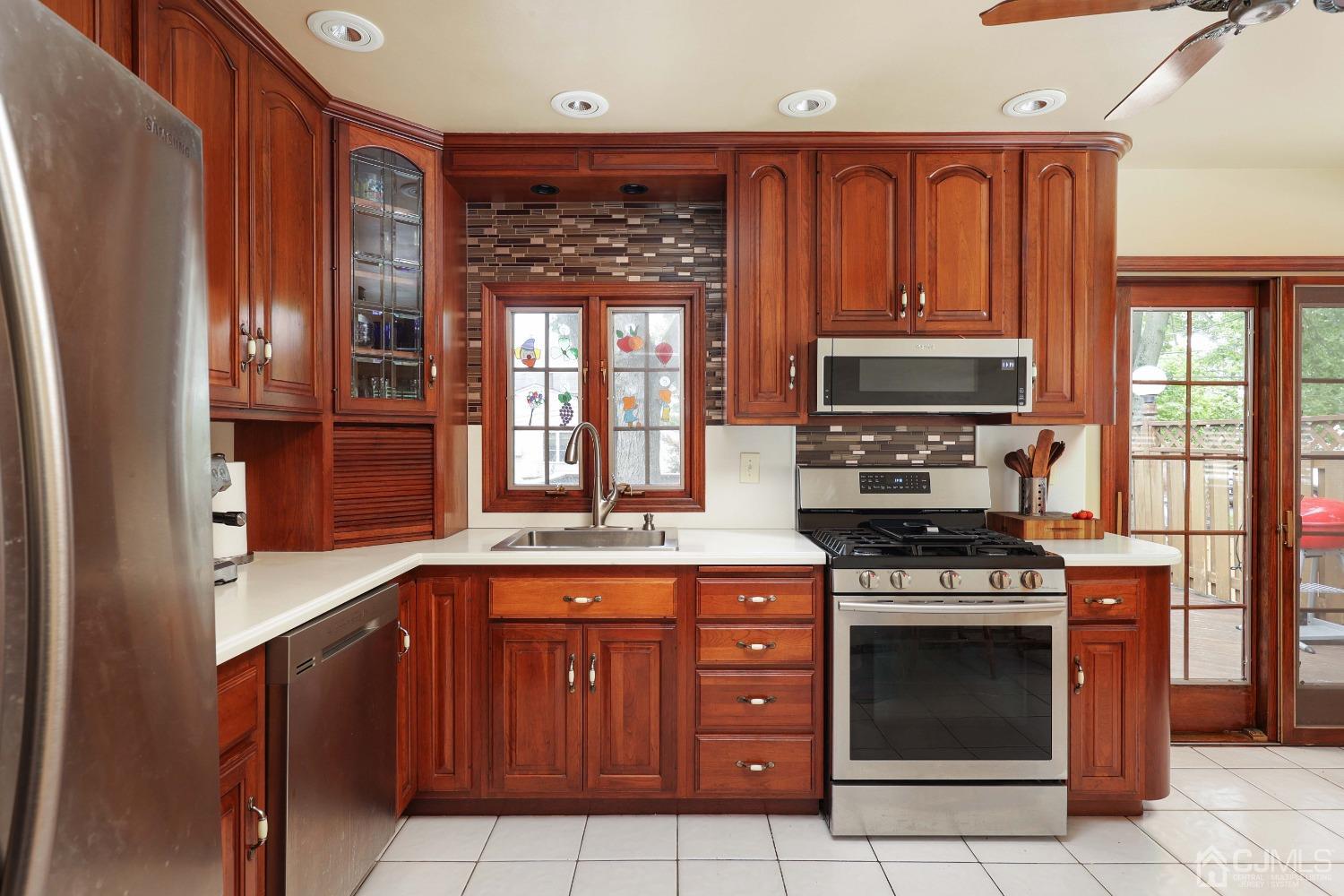 10 Gramercy Road Old Bridge, NJ 08857 - Photo 19 of 31 a kitchen with stainless steel appliances granite countertop a stove and a refrigerator