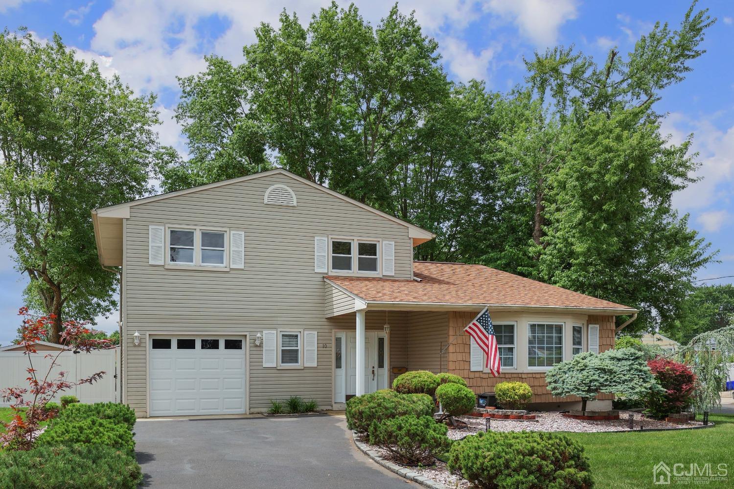 10 Gramercy Road Old Bridge, NJ 08857 - Photo 2 of 31 a front view of a house with a yard and trees